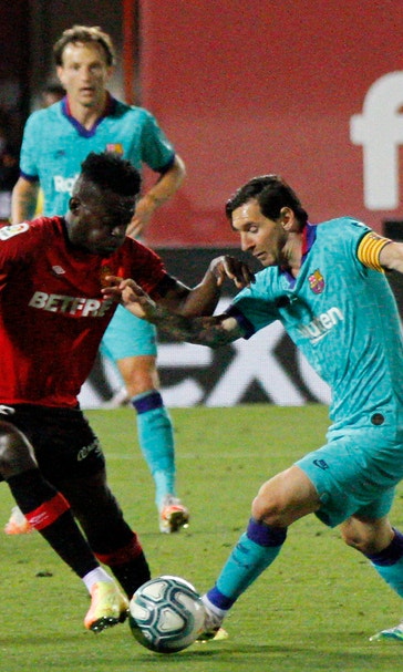 Barca 4-0 win at Mallorca features Messi and pitch invader